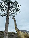 Dinosaurio maqueta tronco fósil igea
