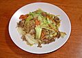 Yakisoba (fried noodles) with pork, onions, cabbage and carrot