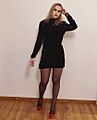 Girl wearing black dress, pantyhose and red heels