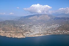 Castell de Ferro and clouds over mountain Lújar 1.jpg