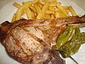 Chuleta de lomo cocinada a la brasa