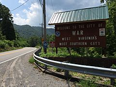 2017-07-22 12 09 09 "Welcome to the City of War" sign along southbound West Virginia State Route 16 (Main Street) at Excelsior A Road (McDowell County Route 102-08) in War, McDowell County, West Virginia.jpg