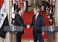 Bush al-Maliki handshake