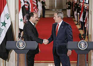 Archivo:Bush al-Maliki handshake