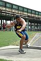 US Navy 050429-N-7975R-001 Midshipman 4th Class Darryl Hunter side steps into position for his first attempt in the shot put event at the Penn Relays