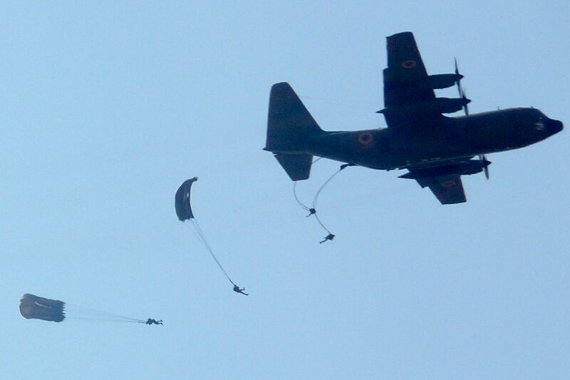 Paratroopers leap from a Cameroonian C-130 transport plane