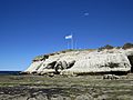 Punta Cuevas y bandera de Argentina