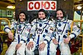Soyuz MS-12 crew members in front of their spacecraft