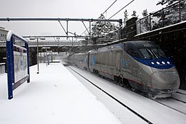 Acela Express in snow near Boston South