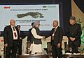 Manmohan Singh shaking hand with the Kiribati President, Mr. Anote Tong, at the 13th Delhi Sustainable Development Summit, in New Delhi. The Union Minister for New and Renewable Energy, Dr. Farooq Abdullah is also seen