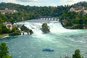 Archivo:Rheinfall mit Rheinfallbrücke und Schloss Laufen