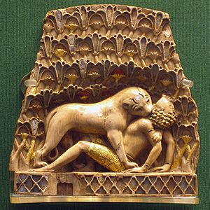 Archivo:Nimrud ivory lion eating a man