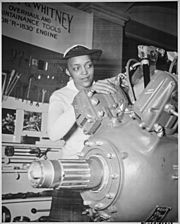 Archivo:"Inspecting a Grumman Wildcat engine on display at the U.S. Naval Training School (WR) Bronx, NY, where she is a `boot' - NARA - 520638