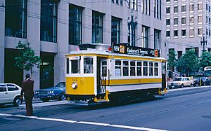 Archivo:1983 SF Historic Trolley Festival - Porto car 122 on Market St at First