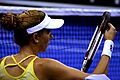 Monica Adjusting Her Racket Strings