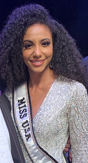 Miss USA Cheslie Kryst and Judge Louis Sola at Miss North Carolina Pageant (cropped).jpg