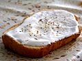 Slice of toast with sour cream and pepper