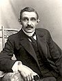 Herman Bang sitting