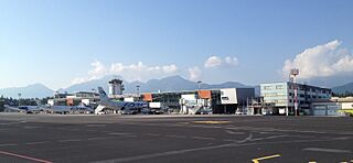 Ljubljana Airport with mountains and Adria Airways planes 2015.jpg