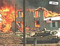 USAWDTX 068-01329 – Abrams tank next to the burning Branch Davidian compound