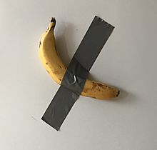 Banana duct taped to fridge as a reminder to eat less meat.jpg