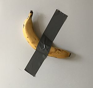 Banana duct taped to fridge as a reminder to eat less meat.jpg