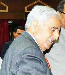 CM J&K,Mufti Mohammed Sayeed and Haji Anayat Ali during his oath ceremony on being elected as Chairman LC on 12 April, 2015 (cropped).jpg