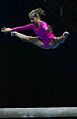 Gymnast jumping on beam