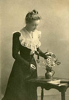 Margaret Sybella Brown with flowers and books.jpg