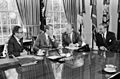 President Richard Nixon seated at his Oval Office desk during a meeting with Henry Kissinger, Alexander Haig, and Gerald Ford