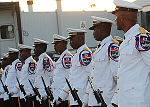 Archivo:Members of the Haitian National Police Force marching band stand at parade