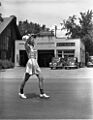 Baton-twirling bobby-soxer in the Parker & Watts Circus Parade on East Huron, Ann Arbor, Michigan, July 8, 1939. (9336248085)