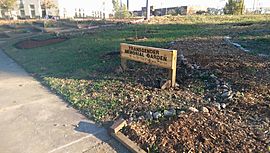 Sign with view of path and plantings, Transgender Memorial Garden.jpg