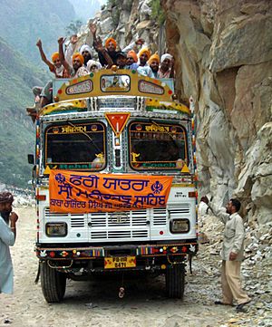 Archivo:Sikh pilgrims cheering on bus to Manikaran
