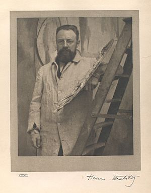 Archivo:Portrait of Henri Matisse standing at his easel