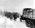Army vehicles on a road in Belgium