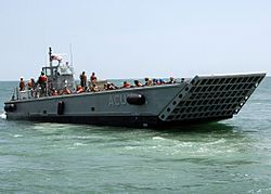 US Navy 090615-N-6676S-456 Landing Craft Mechanized (LCM) 14, assigned to Assault Craft Unit (ACU) 2, transports Sailors, Soldiers and Marines during operations supporting Joint Logistics Over-The-Shore (JLOTS) exercises.jpg