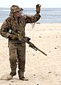 US Navy 100717-N-0683T-292 A U.S. Navy SEAL sniper waves to the crowd during a capabilities demonstration at Joint Expeditionary Base Little Creek, Va