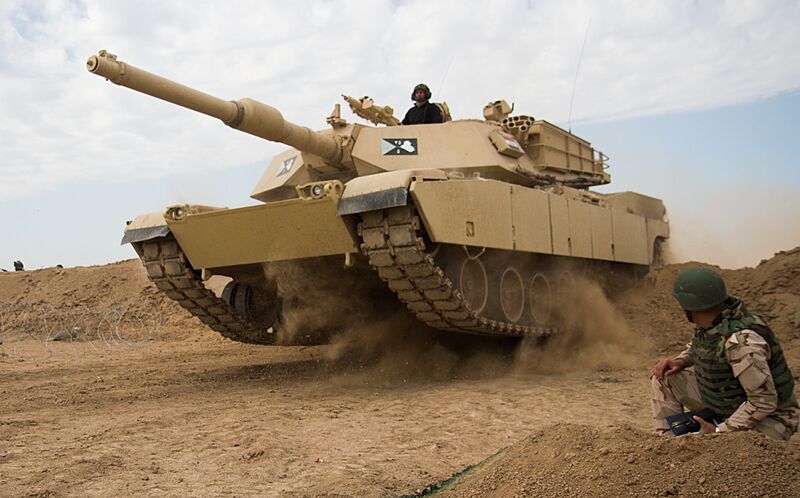 Iraqi tank breaches obstacle 150322-A-BX700-054